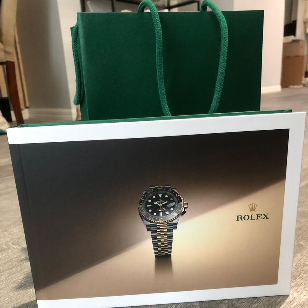Rolex catalogue book and bag